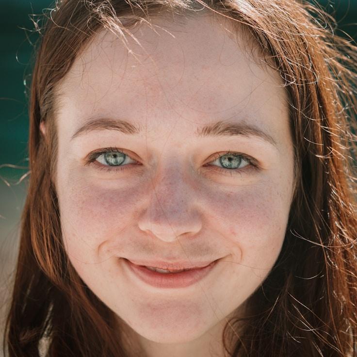 Kaveri Mehta, Lead Design Curator at Pebble Slatea Zure, reviewing corporate floral arrangements